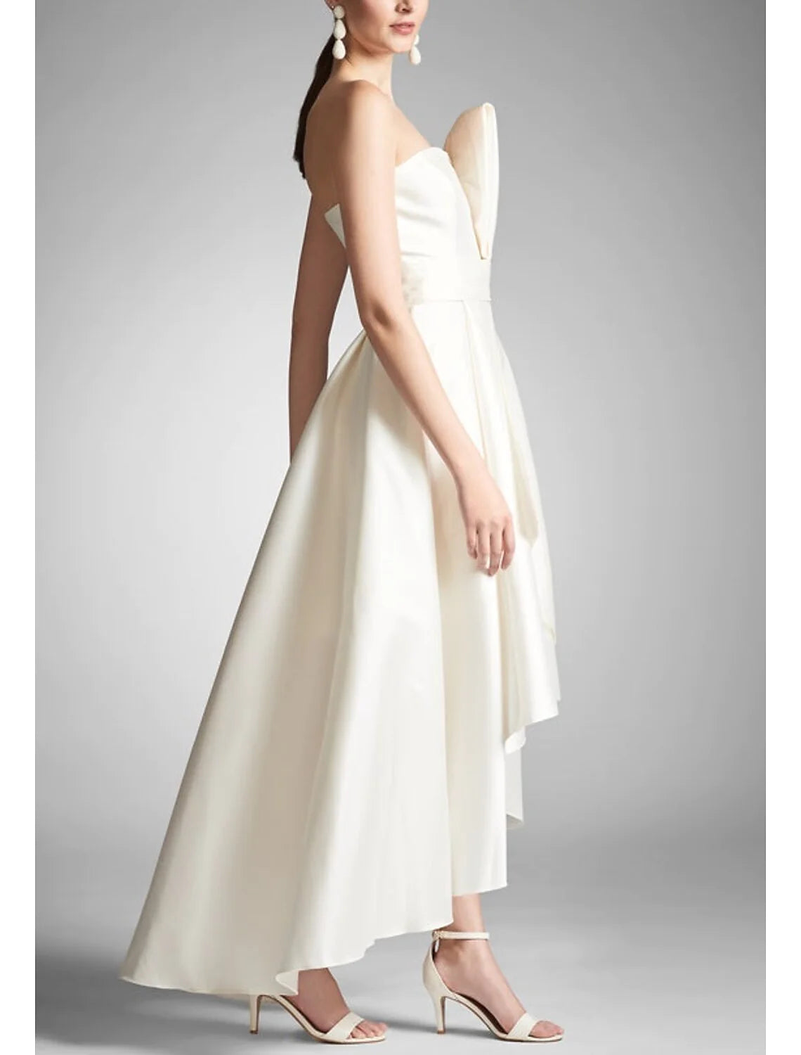 Close-up of the ruched taffeta fabric on an A-line gown.