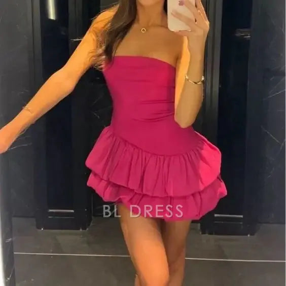 Pink A-line strapless short dress with ruffles.