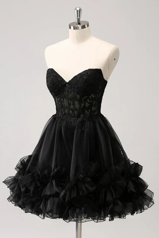 Woman wearing an elegant A-line strapless ruffled corset short homecoming dress.