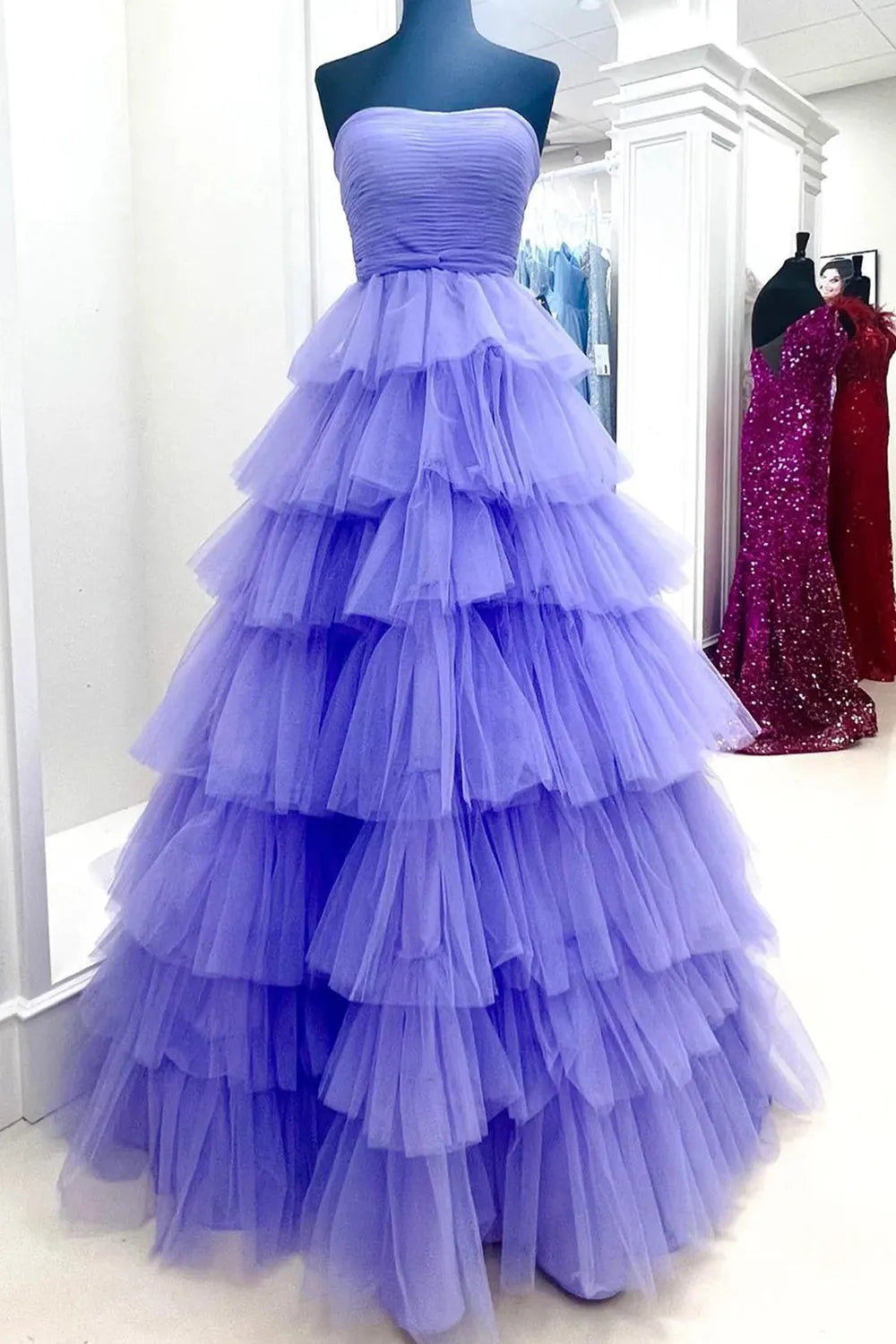 Back view of the A-line strapless long prom dress, showcasing the intricate ruffle details.