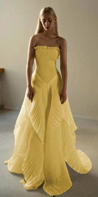 Elegant strapless A-line long prom dress with ruffles and pleats.