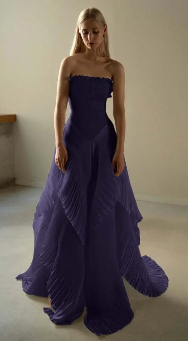 Woman posing in the A-line strapless long formal gown.