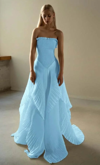 Full length view of the pleated strapless prom dress.