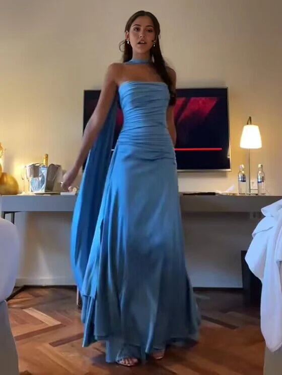 Model wearing an elegant blue A-line strapless satin formal dress.