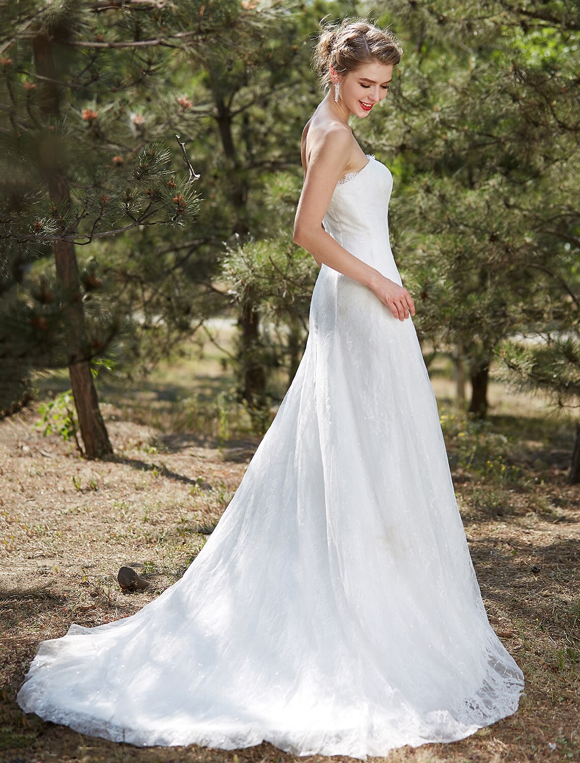 Detail of the bodice and strapless neckline of a satin bridal gown.