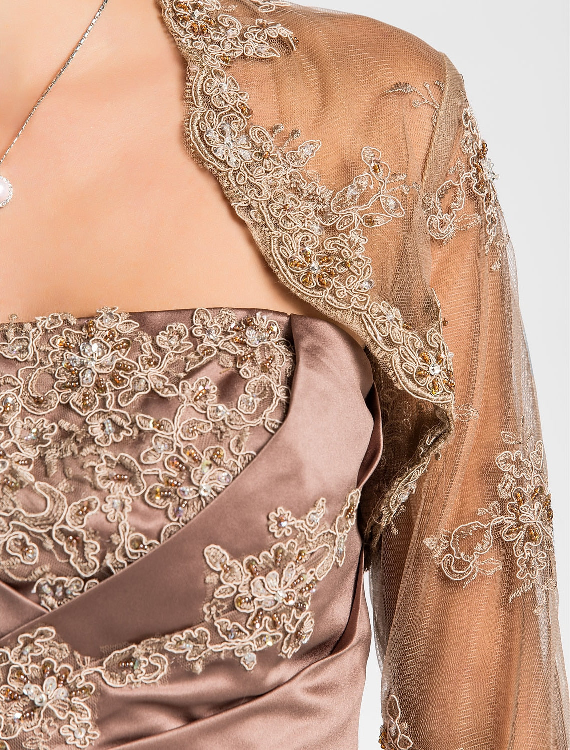 Detail of the strapless neckline on the formal satin gown.