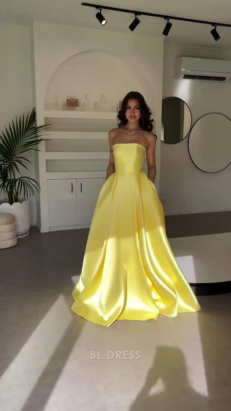 Elegant yellow A-line strapless satin formal dress.