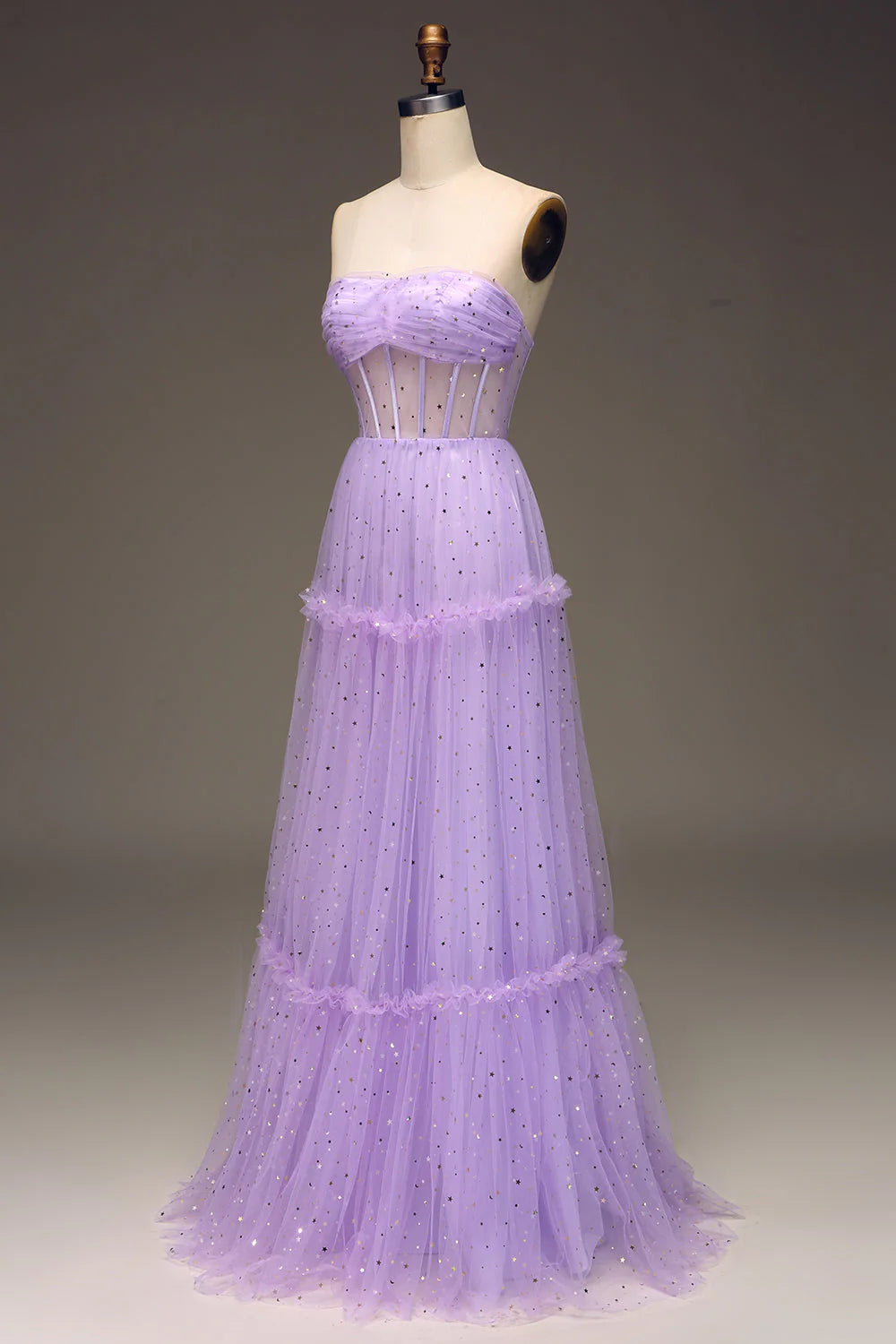 Back view of the purple corset bodice and flowing tulle skirt of the prom dress.