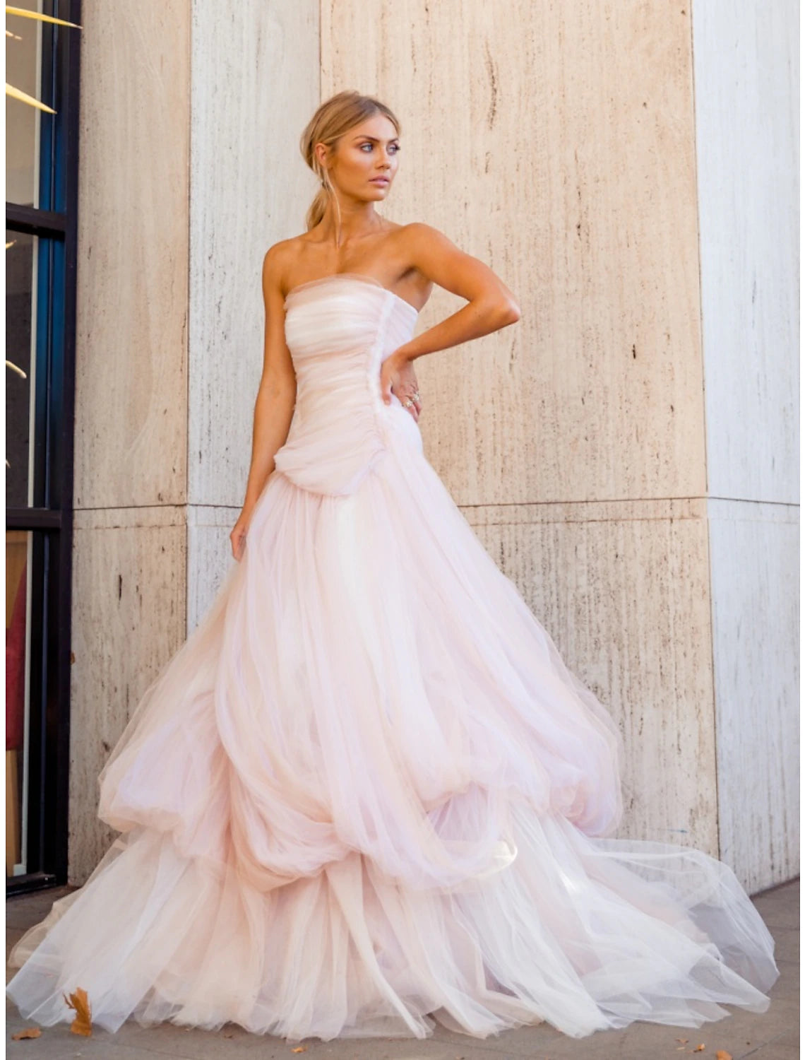 Elegant A-line strapless sweetheart tulle evening gown with pleats and a court train.