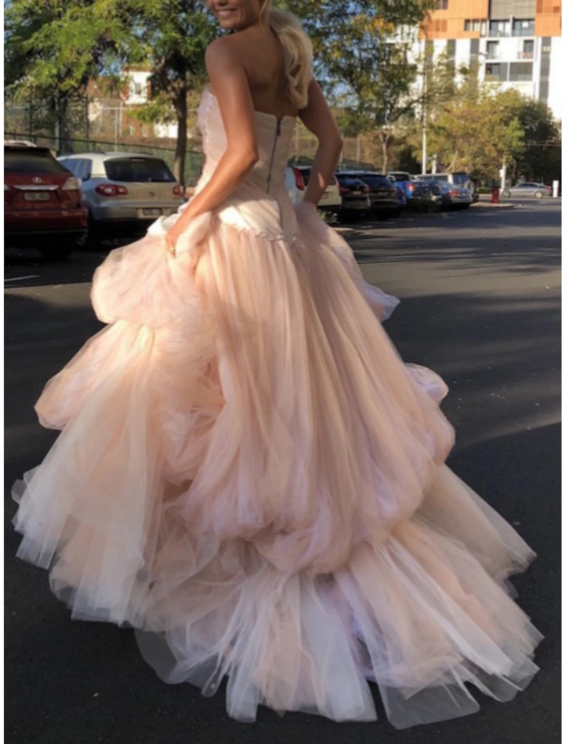 Back view of the A-line tulle evening gown showcasing the court train.
