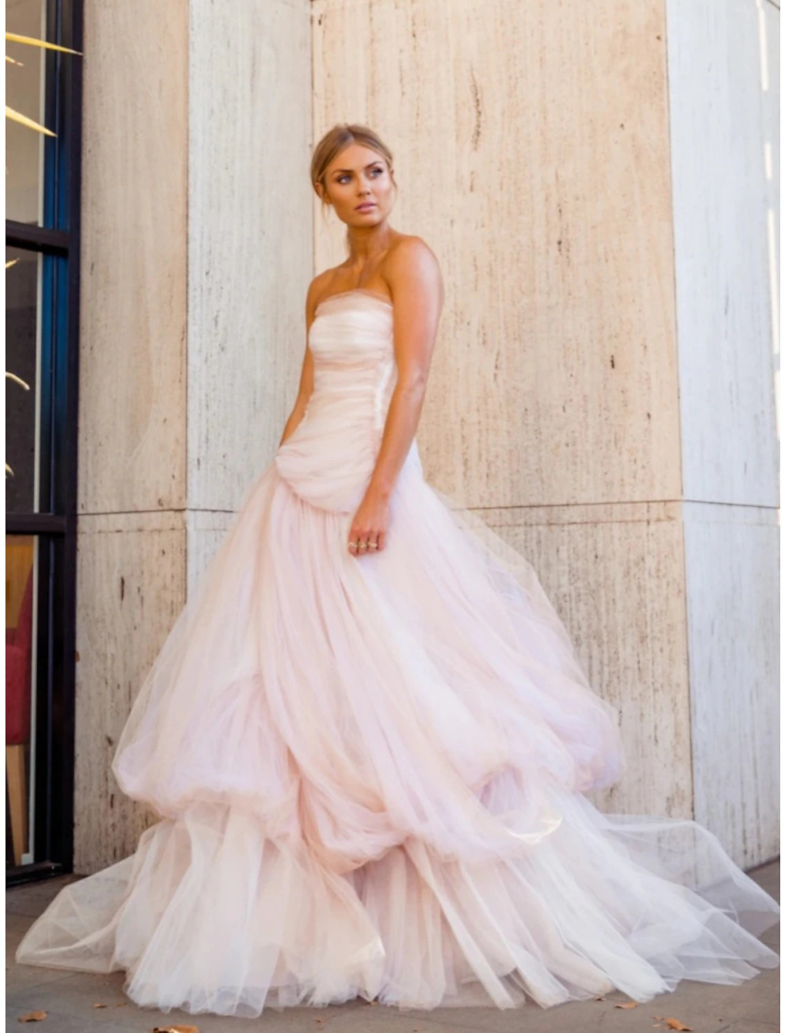 Close-up of the pleated and ruched details on the strapless tulle gown.