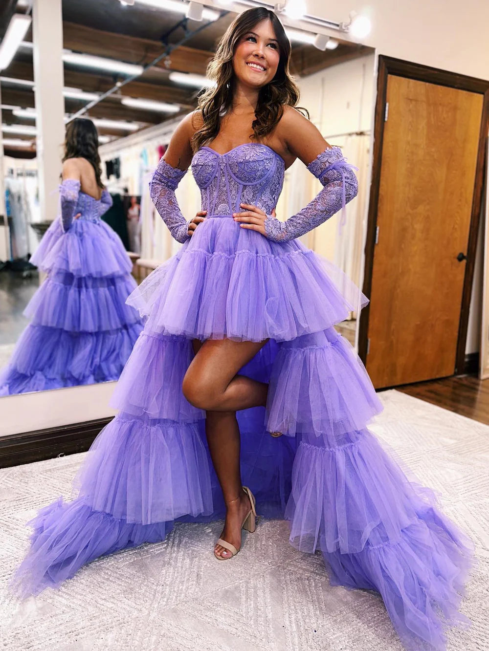 Side view of a strapless A-line formal gown.