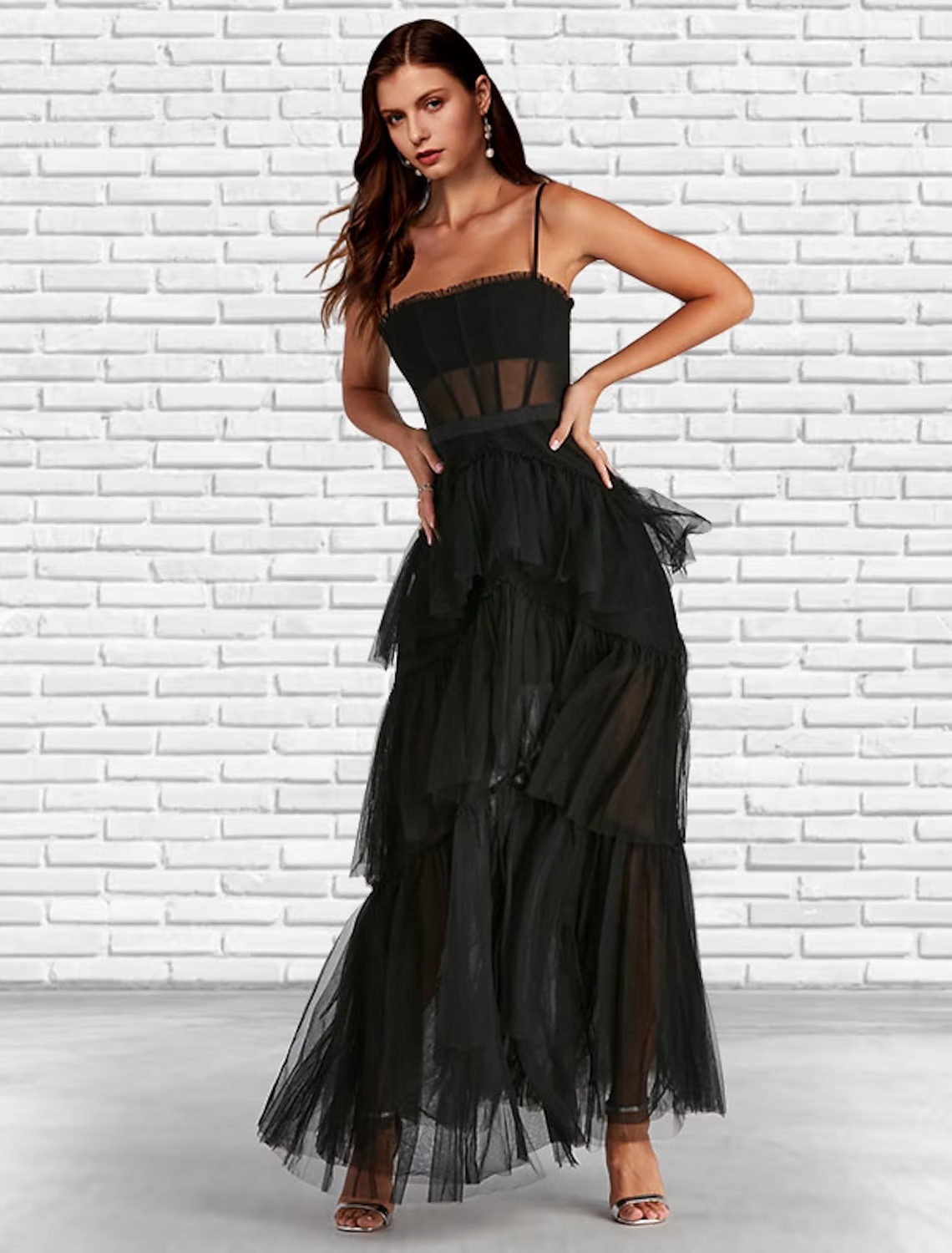 Close-up of the ruffled skirt and tulle fabric of the prom dress.