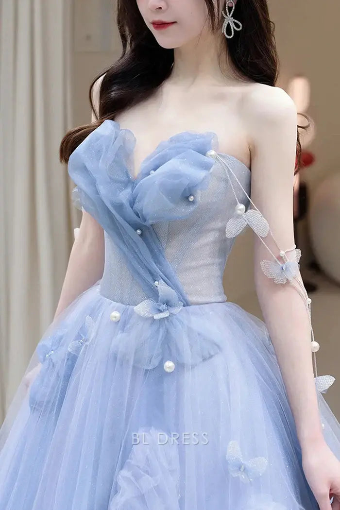 Blue A-line strapless tulle formal dress.