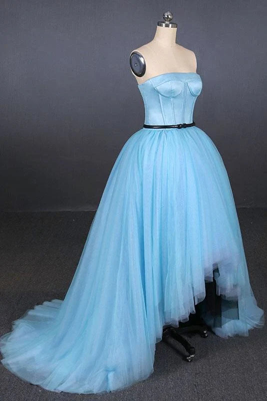 Side profile of a model showcasing a high-low tulle prom dress.