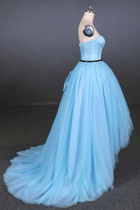 Close-up of the tulle fabric and high-low hem of a prom dress.