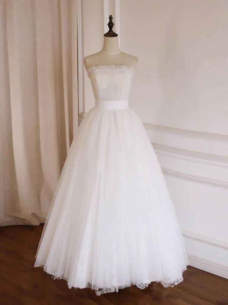 Elegant A-line strapless tulle long prom dress on a mannequin.