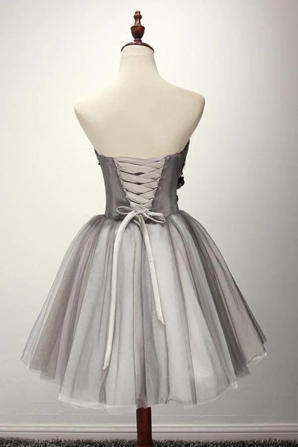 Close-up of the light blue A-line tulle homecoming dress.