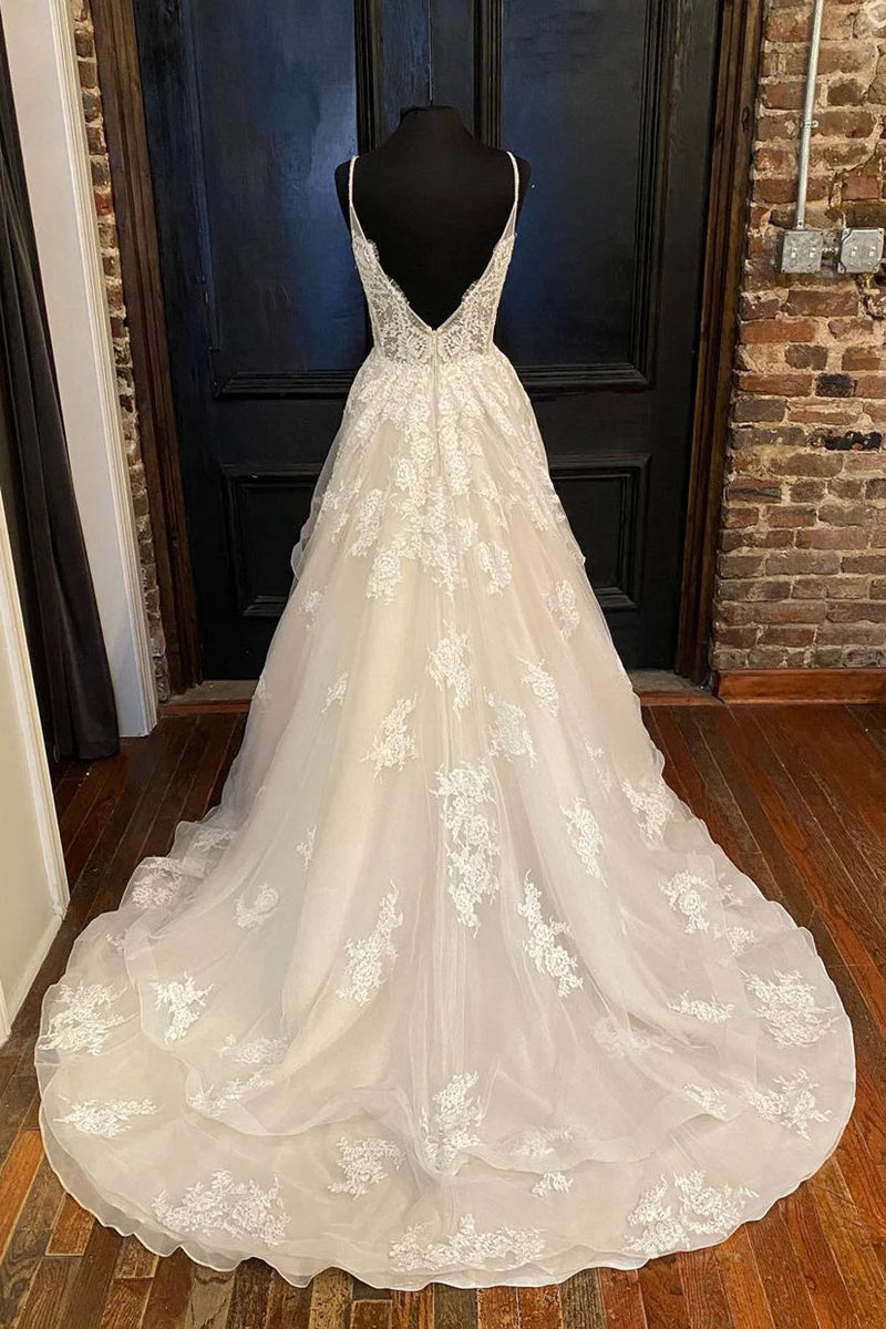 Long A-Line bridal gown featuring a sweetheart neckline and detailed appliques.