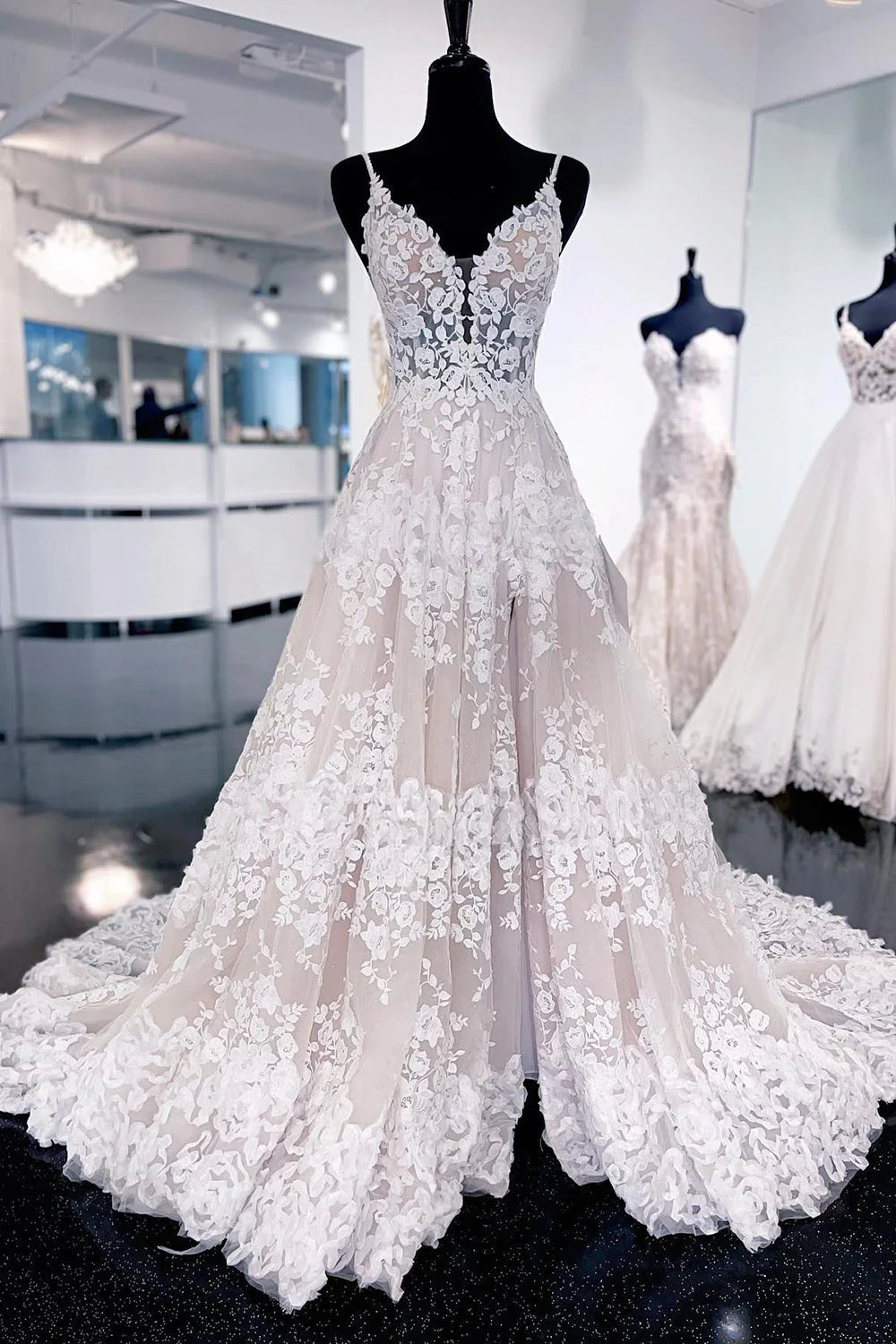 Elegant A-line wedding dress with a sweep train, front view.