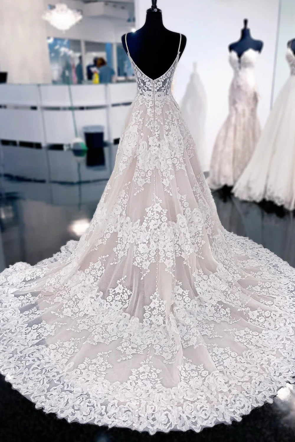 Ivory A-line wedding gown with a long sweep train.