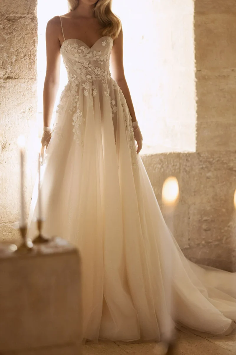 Elegant A-line wedding dress with sweetheart neckline and delicate appliques.