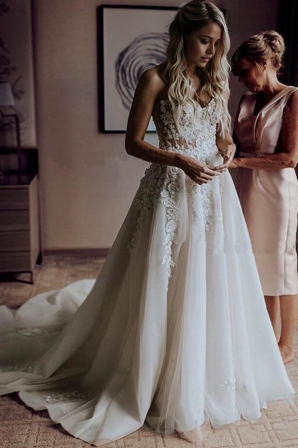Back view of an A-Line sweetheart wedding dress showcasing a graceful sweep train.
