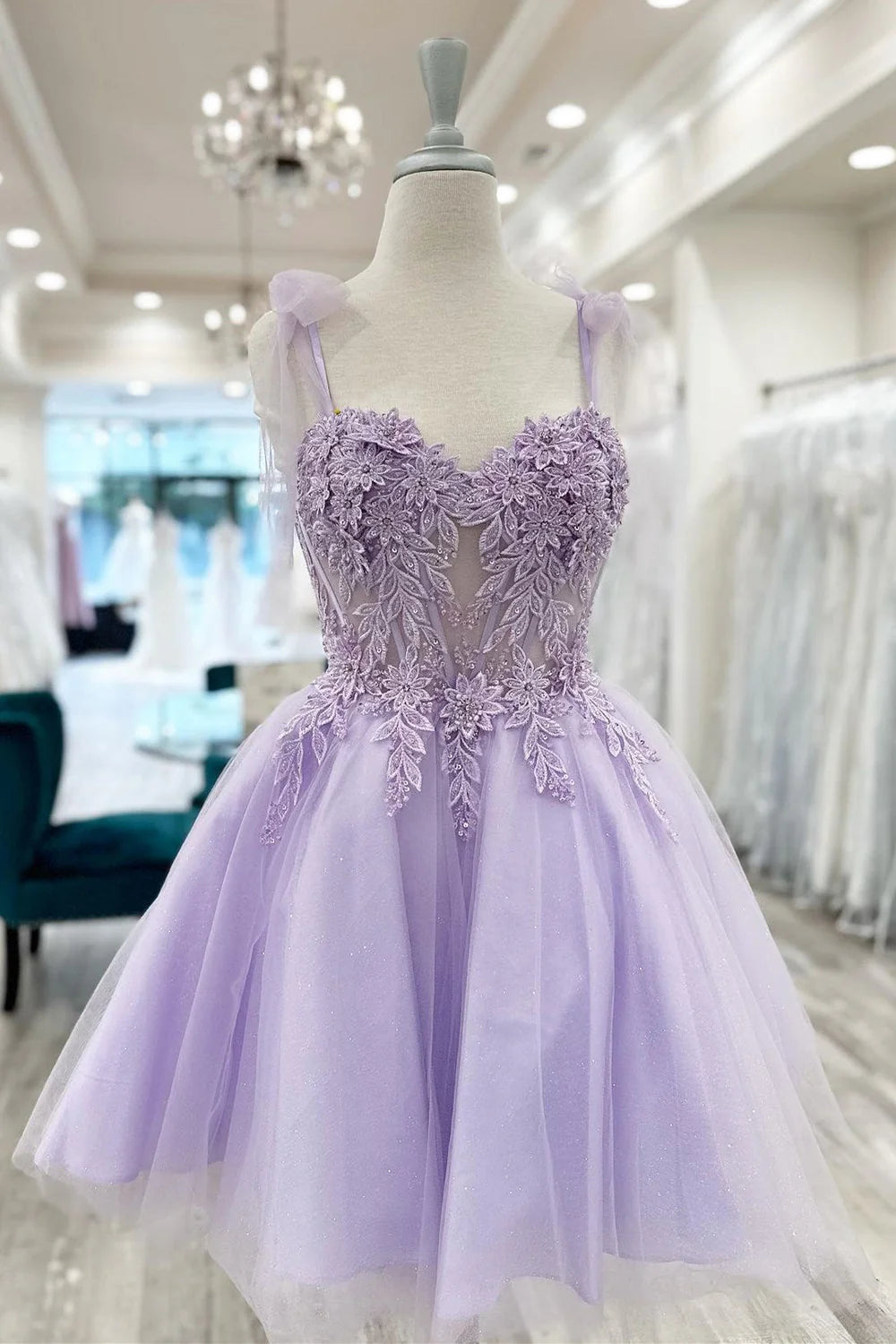 Front view of an A-line sweetheart short homecoming dress with appliques.
