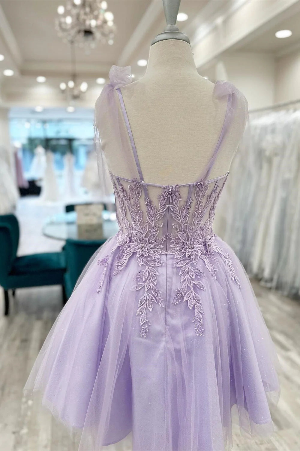 Side view of an A-line sweetheart short homecoming dress with appliques.