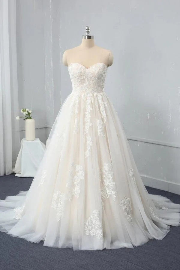 A-Line sweetheart backless wedding dress with lace appliques.