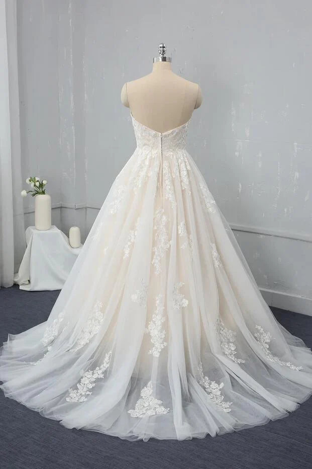 Back view of A-Line tulle wedding gown with delicate lace.