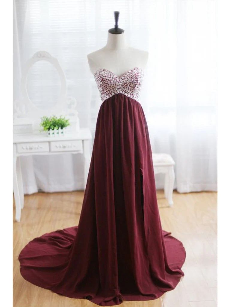 Model wearing an elegant A-Line sweetheart neck backless prom dress with a sweep train.