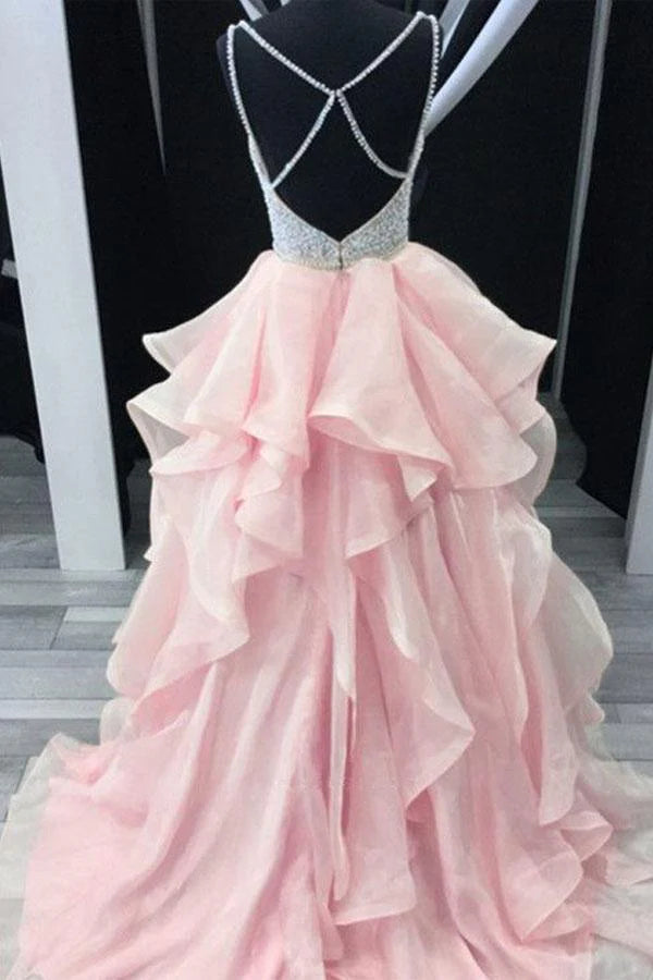Close-up of the beaded bodice and tiered organza skirt on an A-line prom dress.