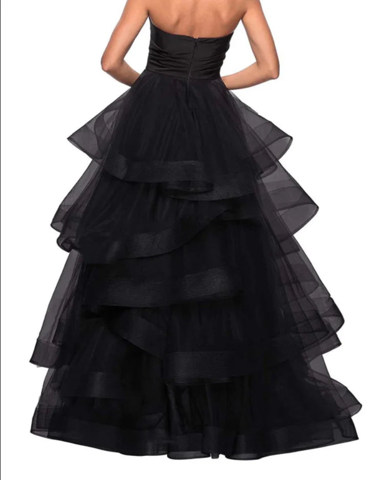 Back view of a flowing A-line formal maxi dress with a sweetheart neckline.