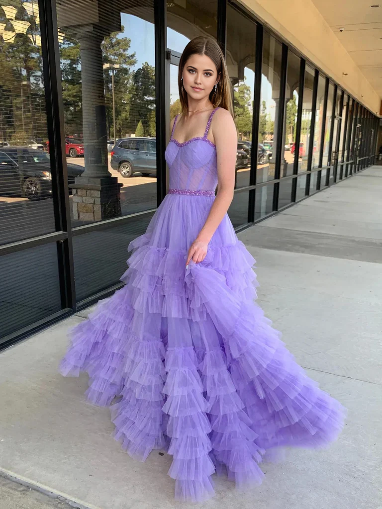 Close-up of the beaded sweetheart neckline on a long prom dress.