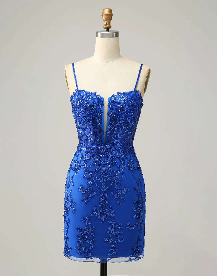 Model wearing an elegant royal blue short homecoming dress with beading and sequins.