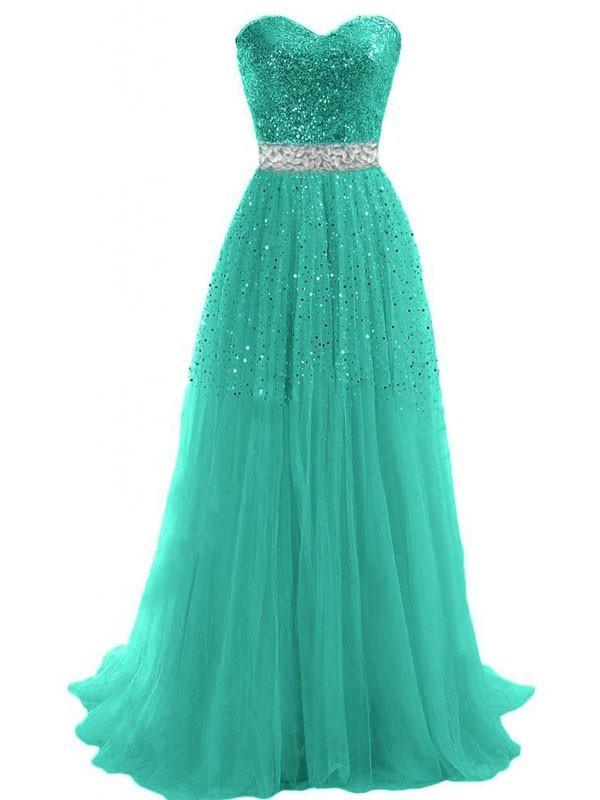 Full length view of a woman wearing a sparkling sweetheart prom gown.