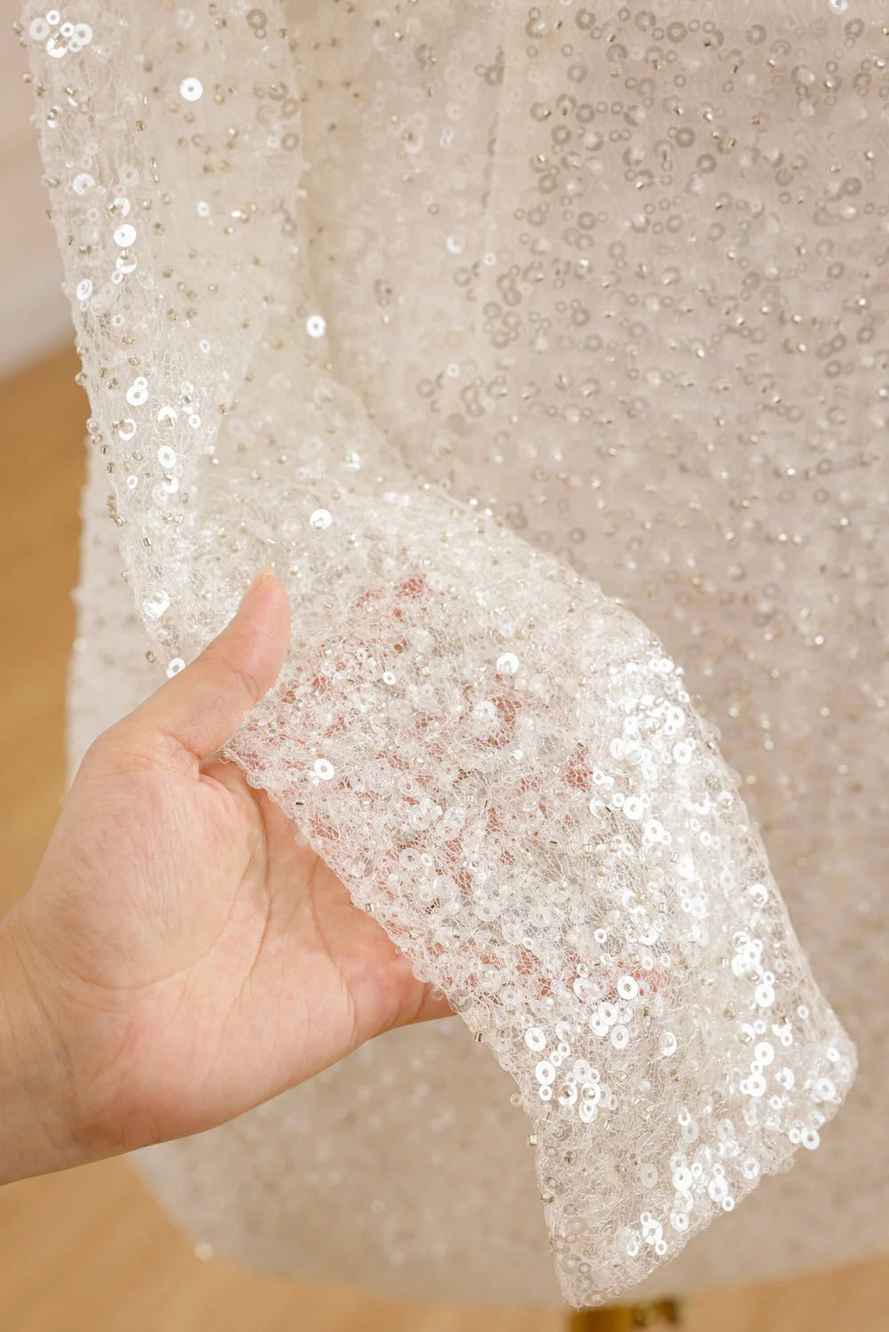 Back view of the short beaded wedding dress, showcasing the silhouette.