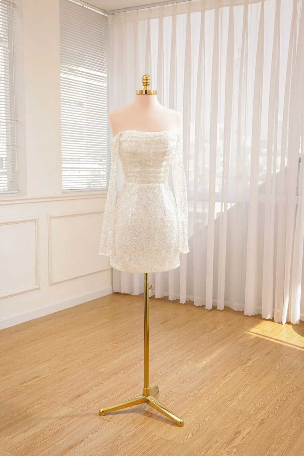 Bride in a short A-line wedding dress, gracefully posing.