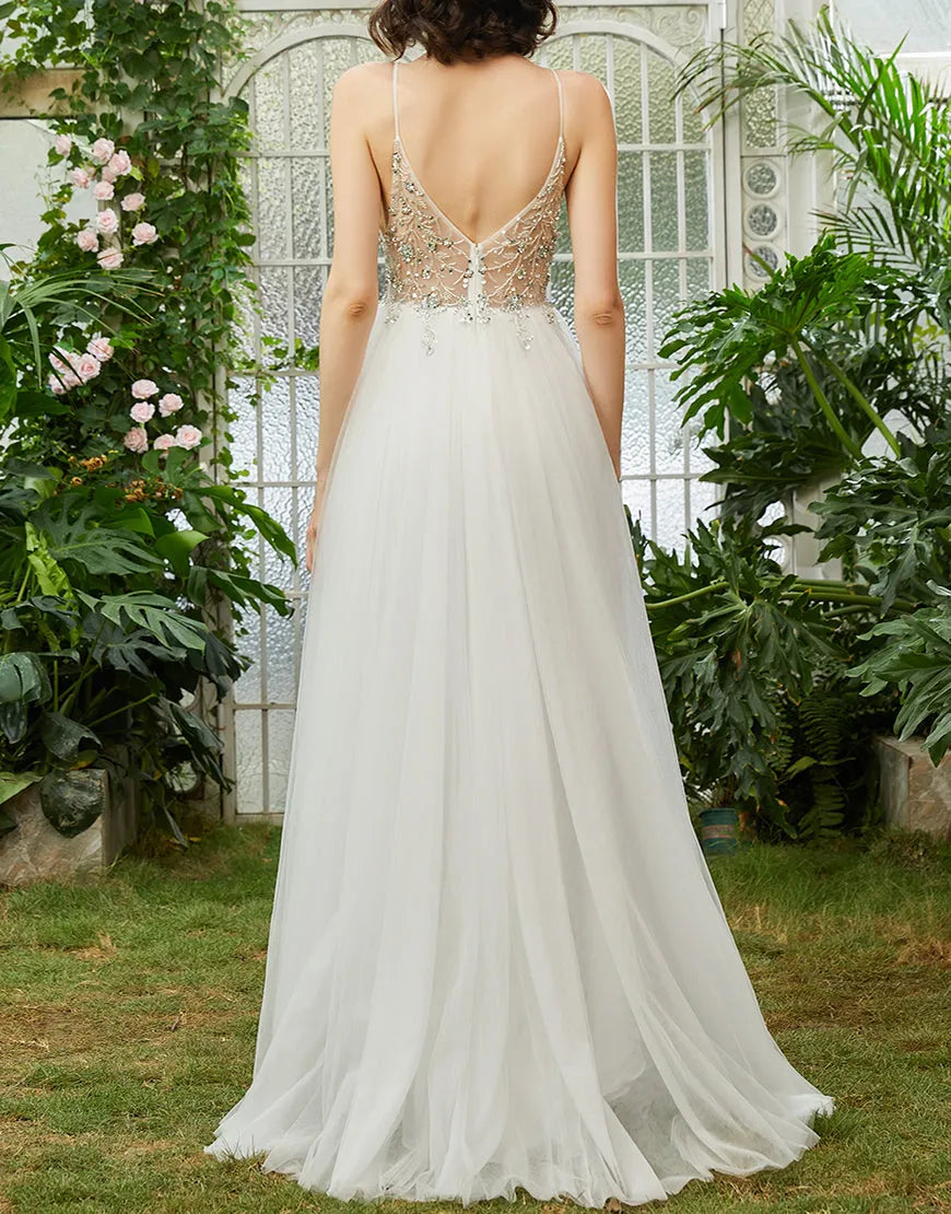 Back view of an A-line long prom dress with delicate beading.