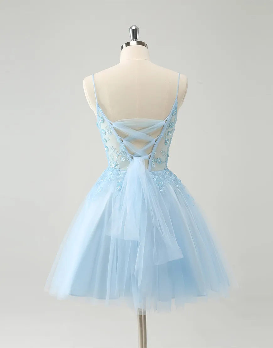 Close-up of the beaded flowers and corset detail on the blue A-line dress.