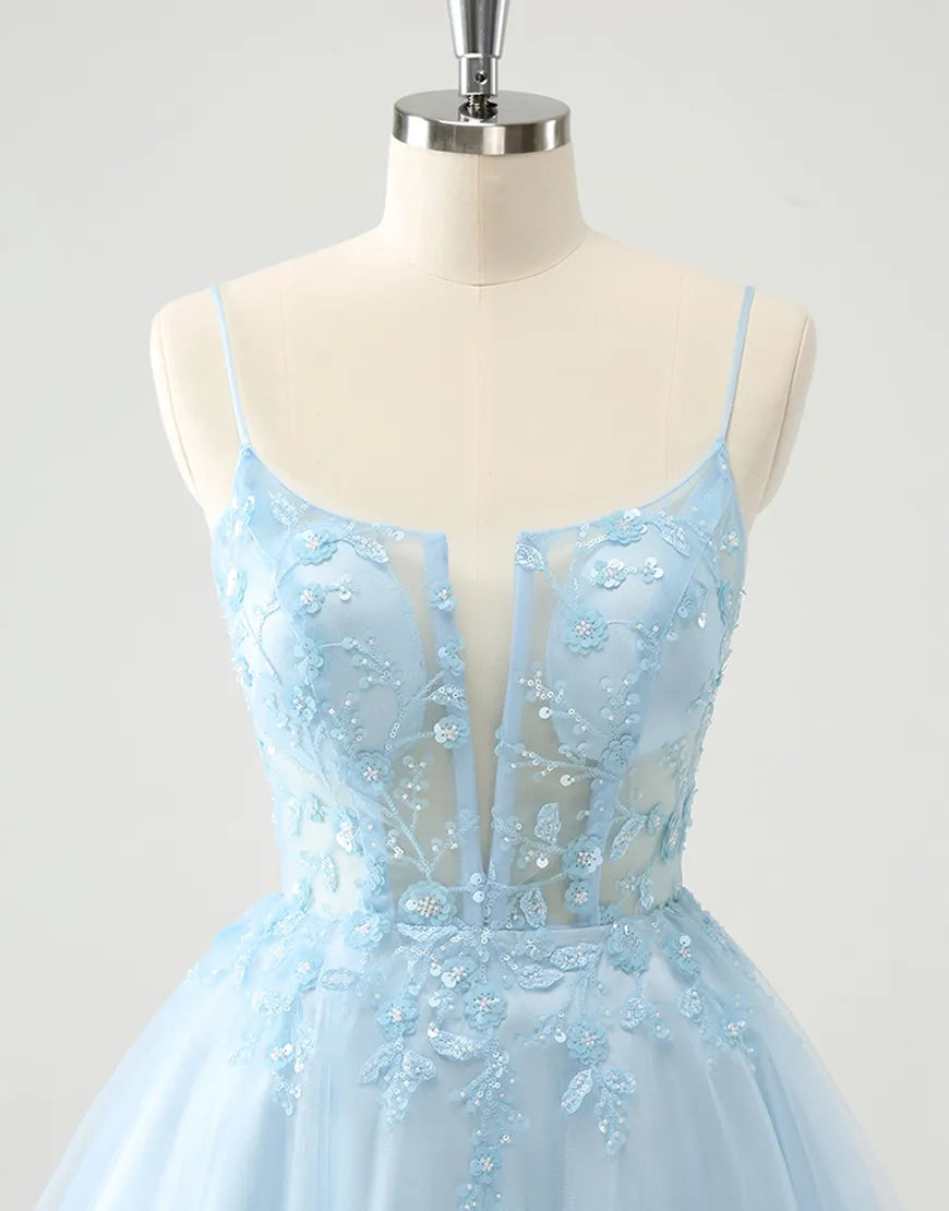 Side view of the blue A-line dress, showcasing the flowing tulle skirt.