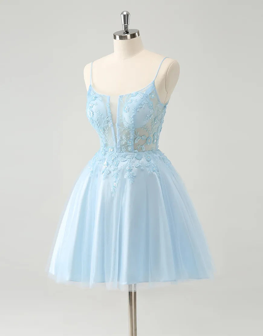 Detail of the sweetheart neckline and beaded bodice of the blue A-line dress.