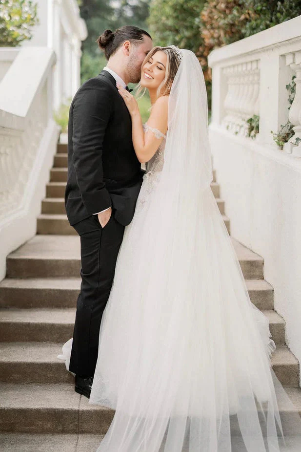 Back view of A-line sweetheart wedding dress with delicate tulle and beading details.
