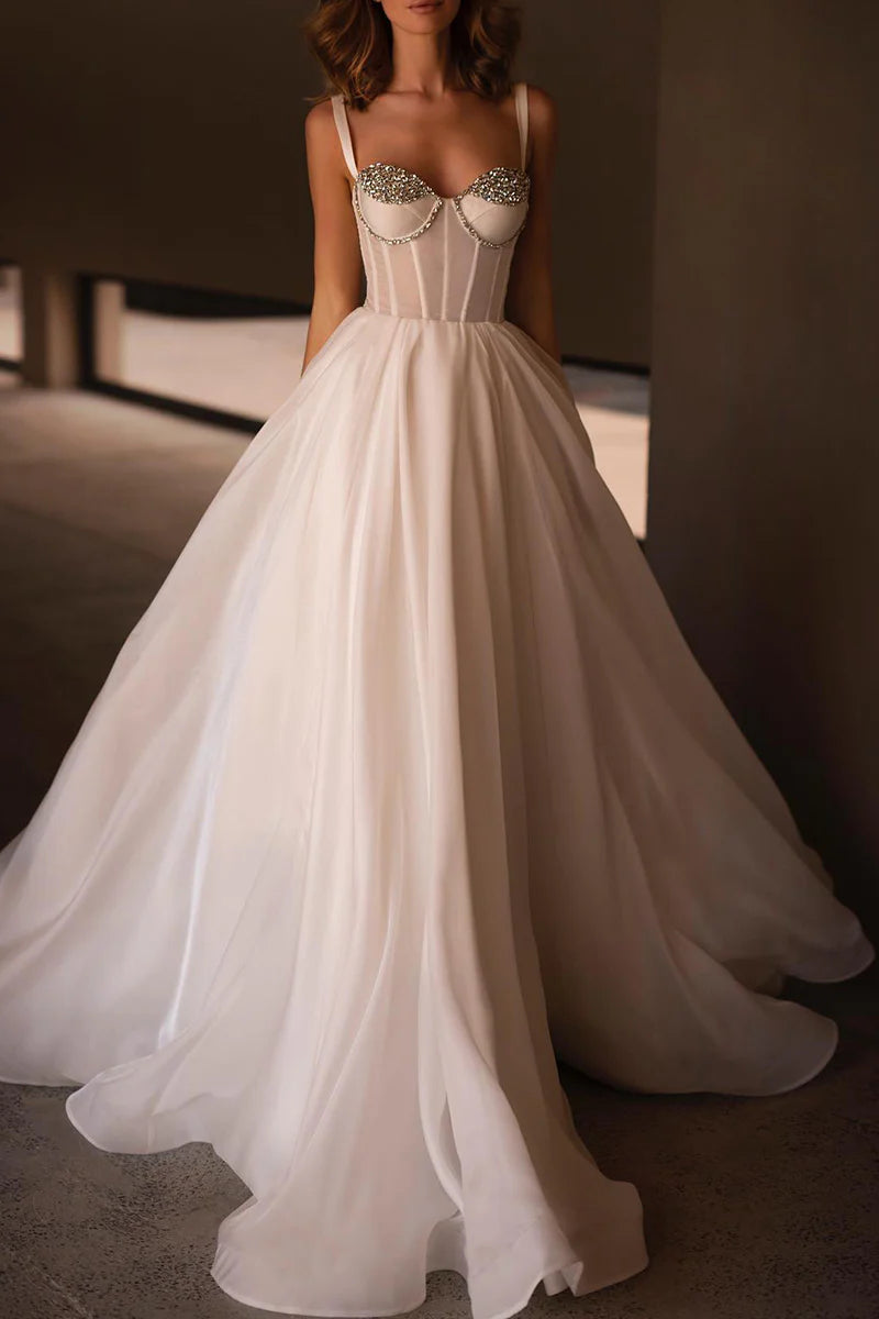 Elegant A-line sweetheart beaded wedding gown, front view.
