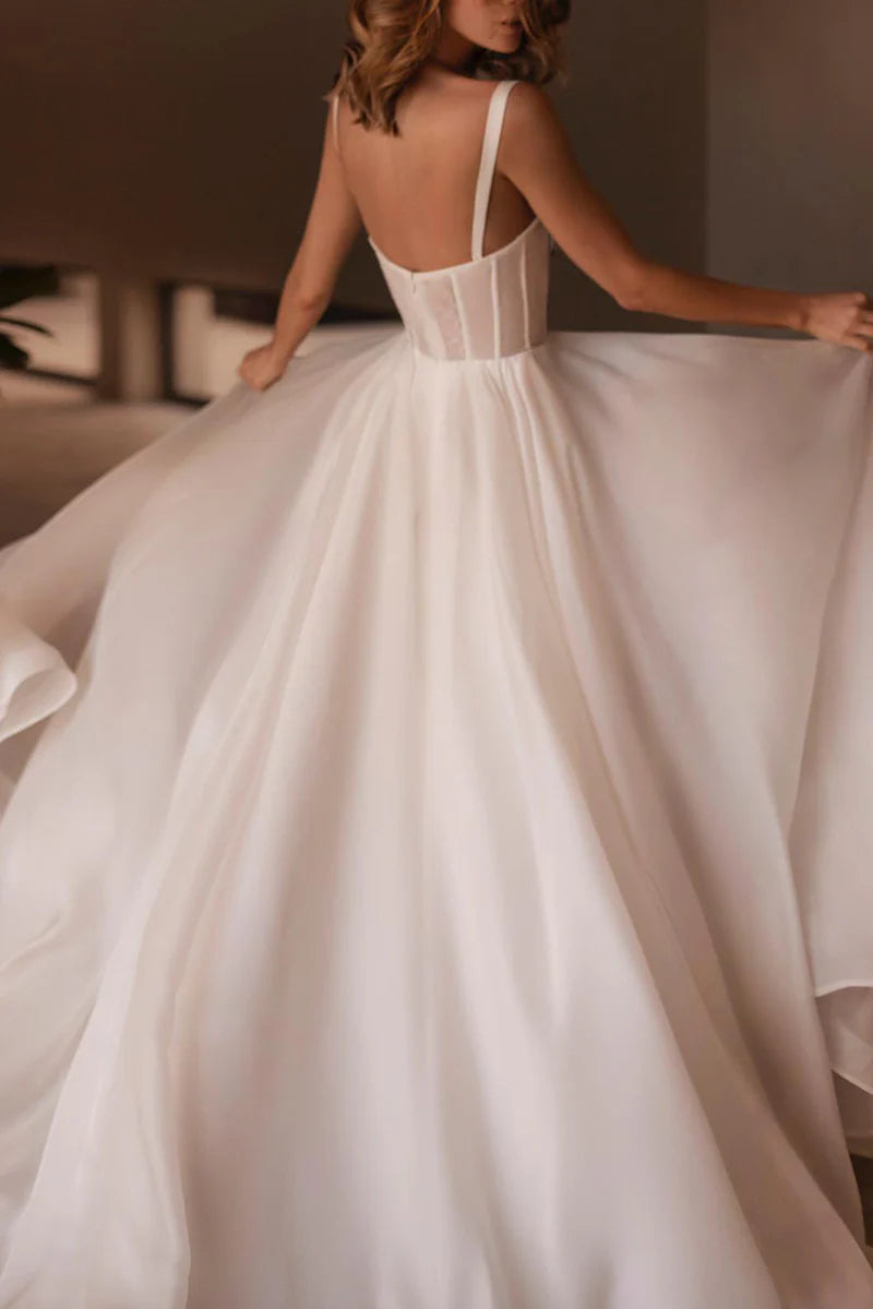 Side view of the A-line sweetheart beaded wedding gown.