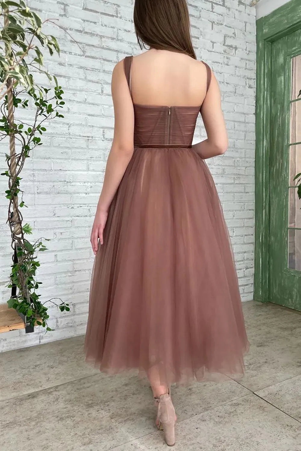 Side view of a brown A-line prom dress.