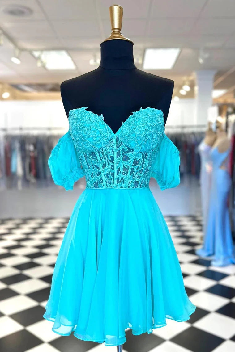Model in an elegant A-line sweetheart chiffon maxi dress with appliques.