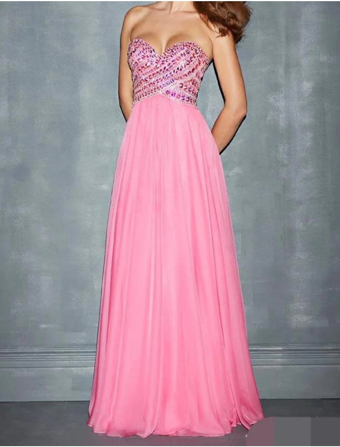 Full length view of a woman wearing the A-line wedding guest dress.