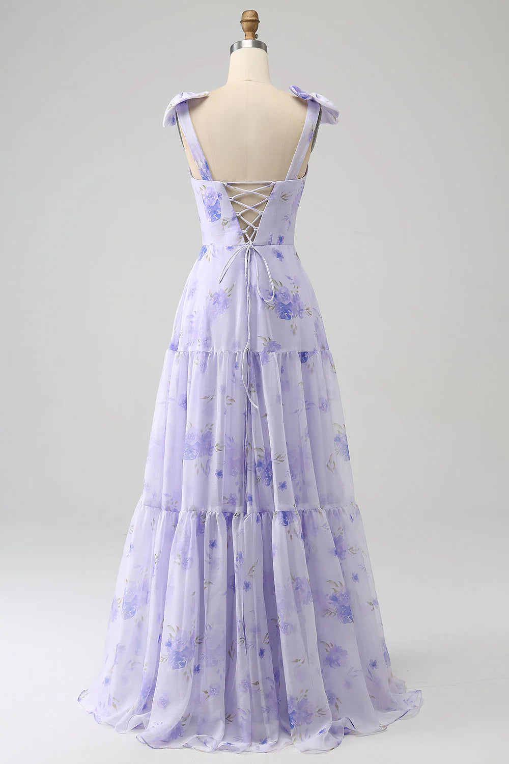 Back view of the lilac A-line prom dress, showing corset lacing and flowing skirt.